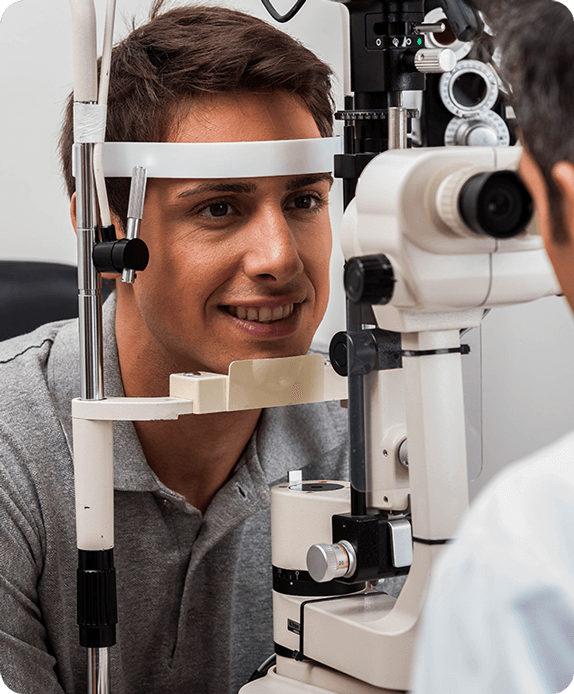 Man smiling getting contact lens exam