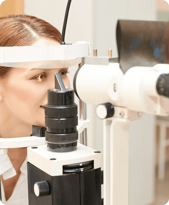 Woman getting eye exam for contact lens