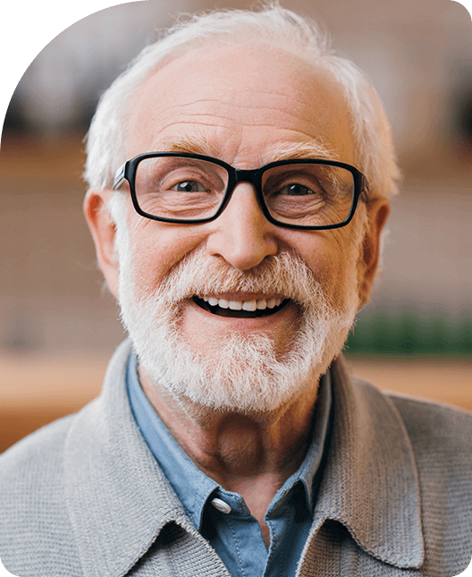 Old man wearing glasses smiling
