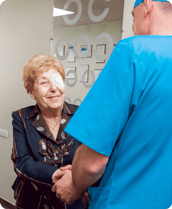Woman thanking doctor after eye operation
