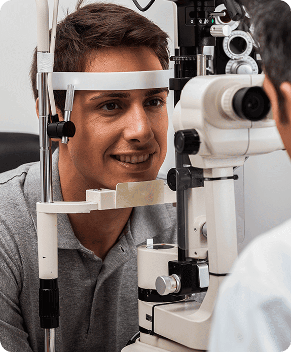 A man is smiling while having his contact lenses examination